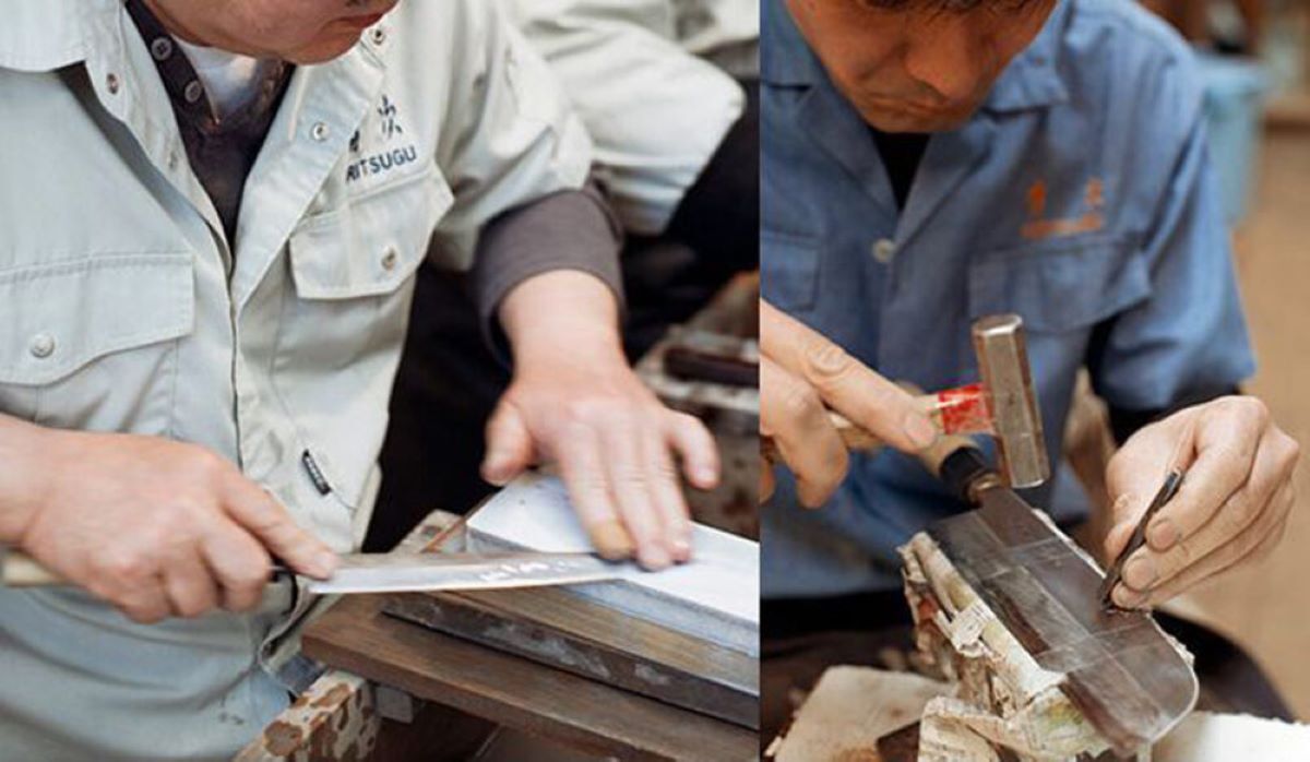A master Aritsugu artisan using a traditional chisel to hand-engrave a name onto a Japanese chef knife.