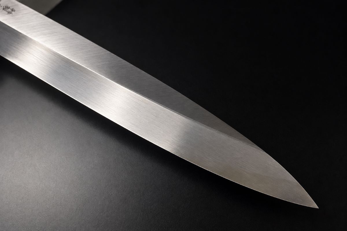 Close-up of the blade bevel and pointed tip of an Aritsugu 270mm Yanagiba Japanese sashimi knife