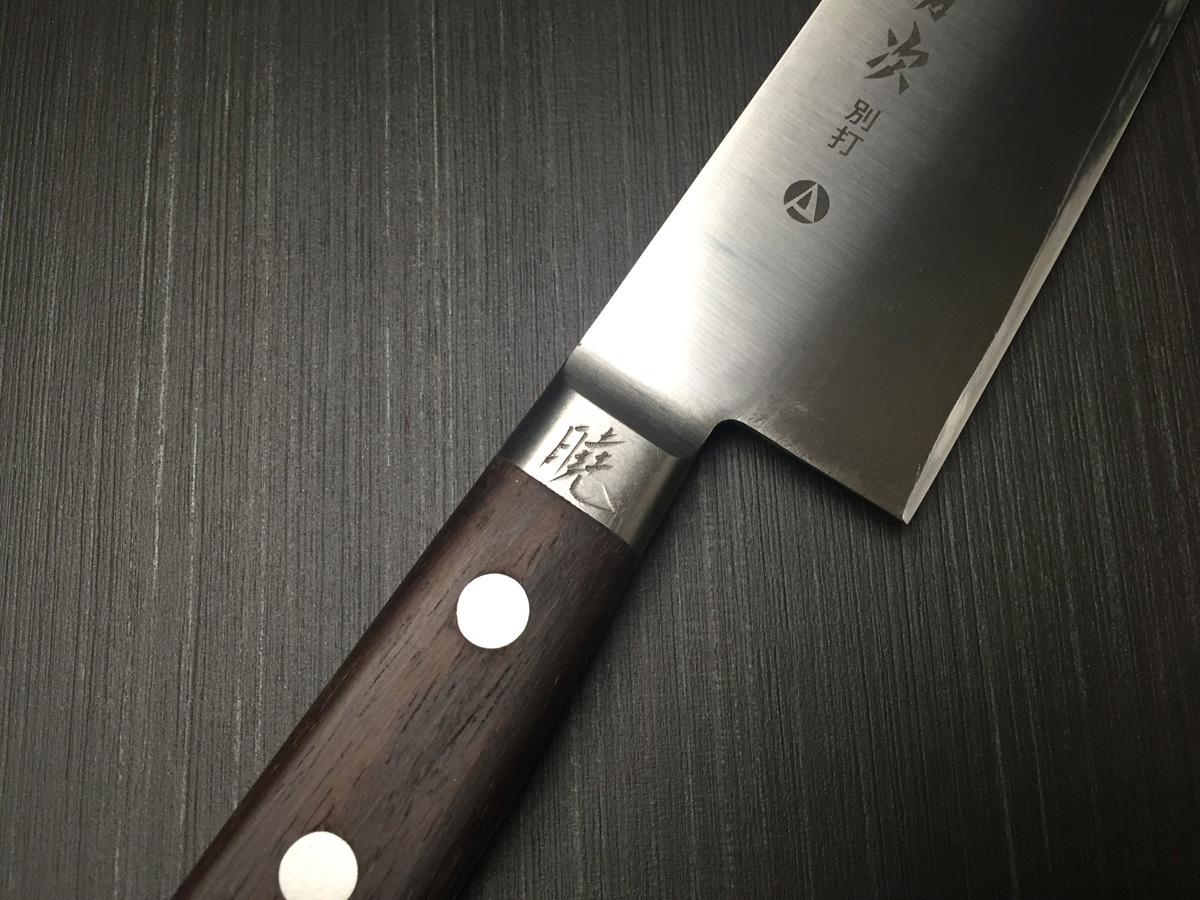 Close-up of a free personalized name beautifully hand-engraved on an authentic Japanese kitchen knife.